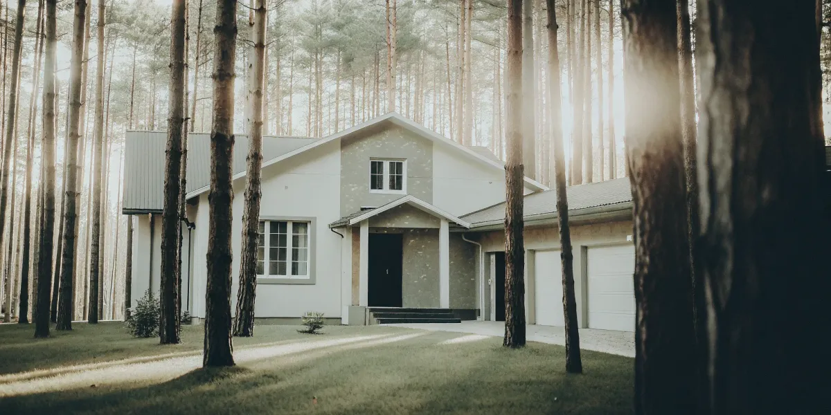 A home with a cleared yard that meets defensible space requirements for wildfire protection.
