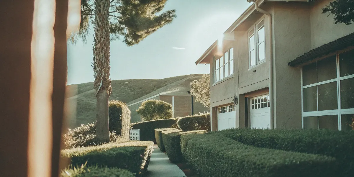 San Diego home with cleared vegetation passing a defensible space inspection.