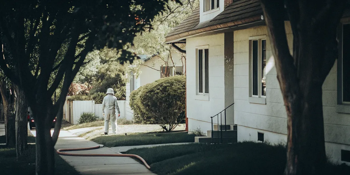 Home inspector checking a house's exterior to pass a home insurance fire inspection.