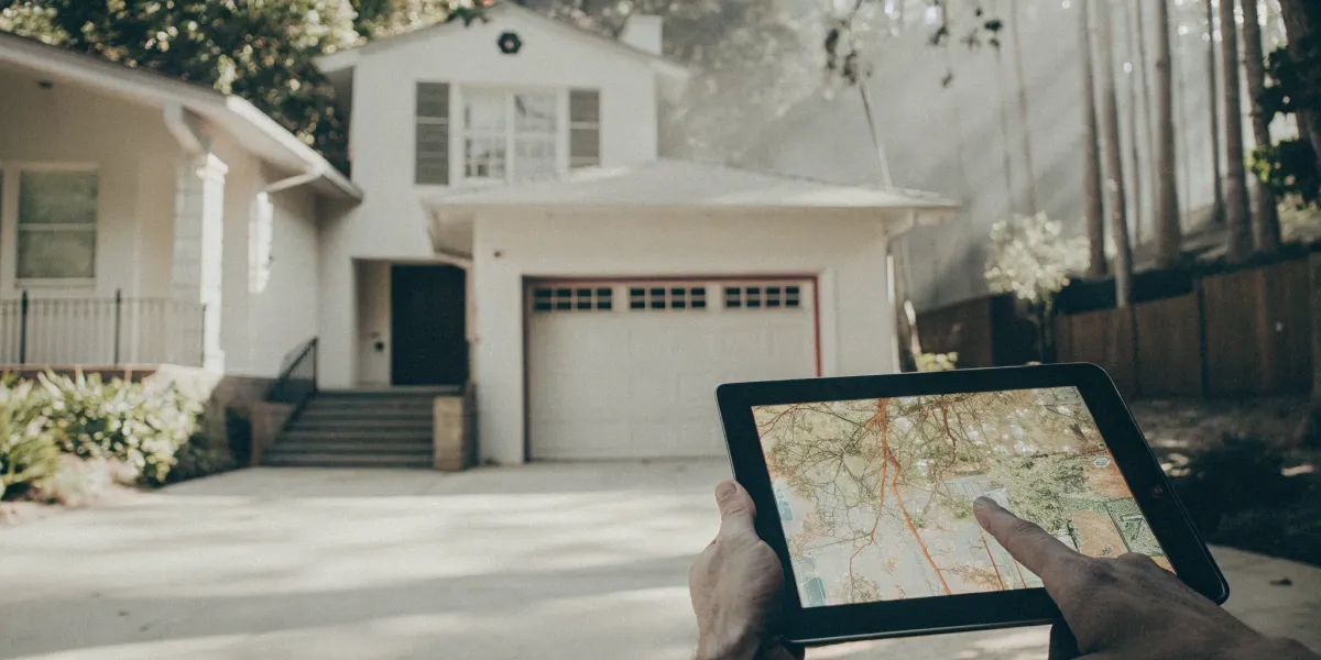 A person using one of the best home wildfire risk assessment tools on a tablet.