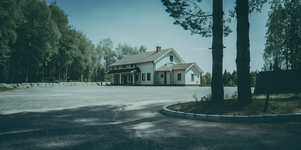 A home surrounded by trees in a high-risk fire area needs the best insurance.