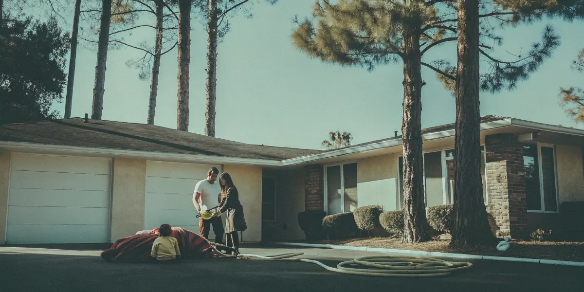 Family packing a wildfire go-kit and reviewing their preparedness checklist.