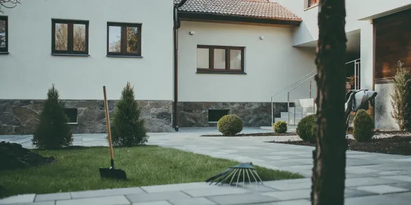 A yard with cleared vegetation and trimmed bushes prepared for a defensible space inspection.