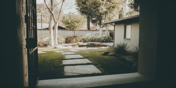 An example of defensible space in California featuring a stone path and well-maintained, fire-resistant plants.