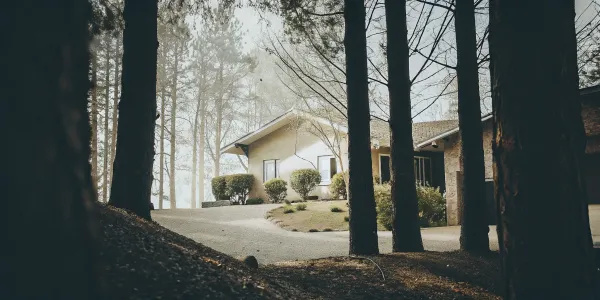 A California home with cleared landscaping meeting defensible space requirements.